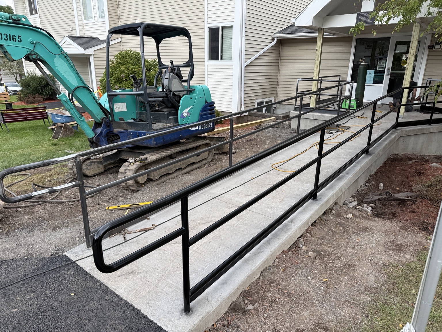 Custom accessibility ramp railing installation